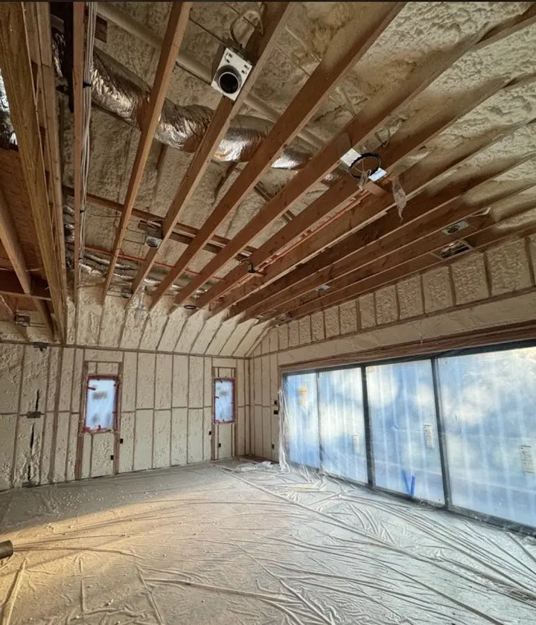 Interior walls and ceiling insulated with spray foam during new construction in Millington